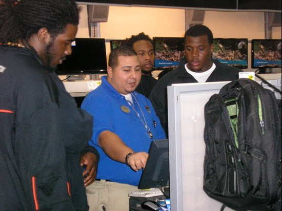 Hurricanes take part in shopping spree at Best Buy as a part of the team's Champs Sports Bowl gift.