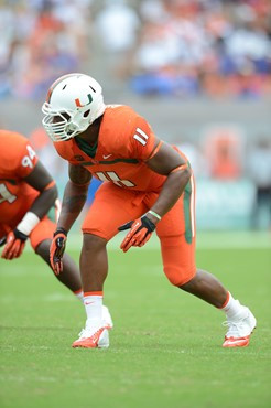 Defensive lineman David Gilbert #11 and The University of Miami Hurricanes plays in a game against the #12 ranked University of Florida Gators at Sun...