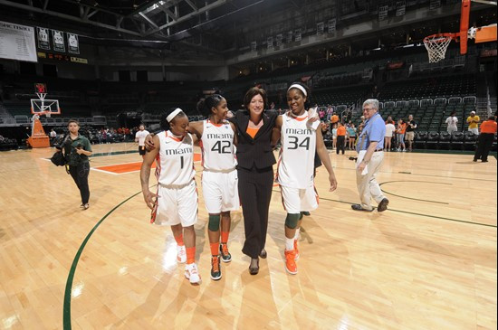 Seniors Riquna Williams, Shenise Johnson and Sylvia Bullock walk off the BankUnited floor with head coach Katie Meier one last time after the Canes...