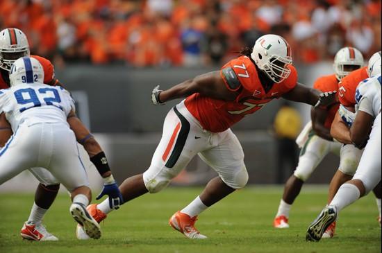 University of Miami Hurricanes offensive lineman Seantrel Henderson #77 gets set to block against the Duke Blue Devils at Sun Life Stadium on November...