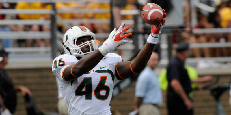 Johnson Rushes for 3 TDs in 52-45 Win at Duke