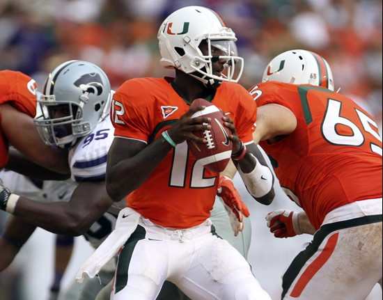 Miami quarterback Jacory Harris (12) looks to pass during the first half. (AP Photo/J Pat Carter)