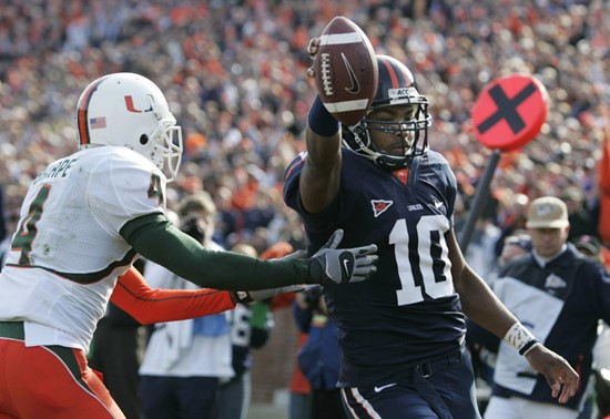 Virginia quarterback Jameel Sewell (10) scores a second touchdown as Miami defender Glenn Sharpe (4) closes in during first half action of the...