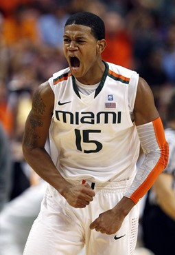 Miami guard Rion Brown celebrates a 3-point shot. Miami defeated Florida Atlantic 93-90 in double overtime. (AP Photo/Wilfredo Lee)