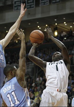 Miami's Durand Scott (1) shoots as North Carolina's Larry Drew II (11) defends in the second half during an NCAA college basketball game in Coral...