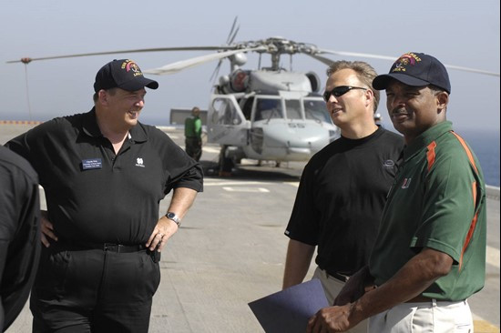Miami Football Coach Randy Shannon talks with Notre Dame's Charlie Weis and Georgia's Mark Richt on the flight deck of the USS Nassau.Photo: Todd Van...