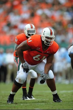 University of Miami Hurricanes offensive lineman Joel Fiqueroa #61 plays in a game against the North Carolina Tar Heels at Dolphin Stadium on...