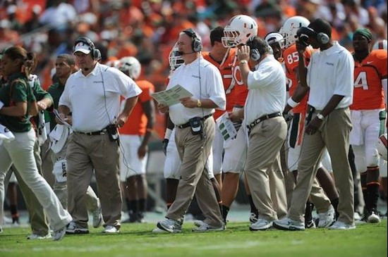 University of Miami Hurricanes head coach Randy Shannon, Joe Pannunzio, and Clint Hurtt on the sidelines in a game against the Virginia Cavaliers at...