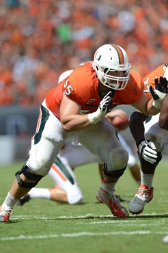 University of Miami Hurricanes offensive lineman Brandon Linder #65 and the Canes take on the North Carolina State Wolfpack at Sun Life Stadium on...