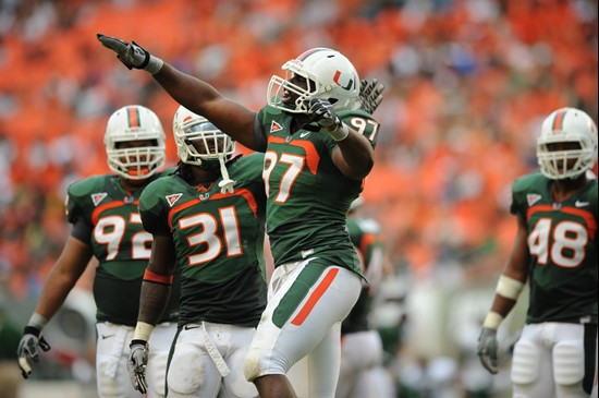 University of Miami Hurricanes defensive lineman Adewale Ojomo #97 celebrate after making a tackle in a game against the University of South Florida...