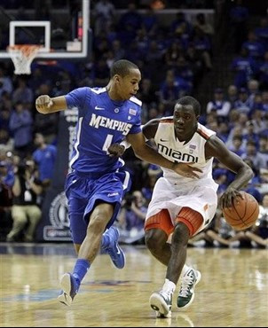 Miami forward Durand Scott (1) takes the ball down court against Memphis guard Charles Carmouche (4) during the first half of an NCAA college...