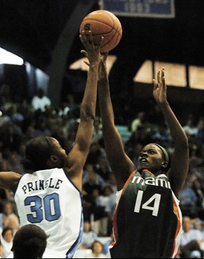 Miami's Charmaine Clark (14) is blocked by North Carolina's LaToya Pringle (30) during the second half of a college basketball game in Chapel Hill,...