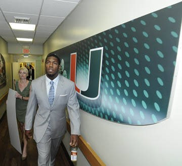 Jonathan Vilma makes his way to the Edgerrin James Room for press conference.
