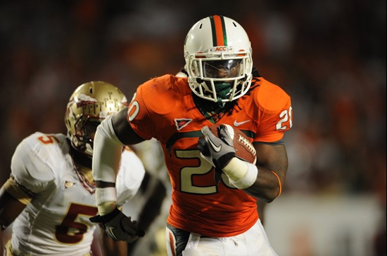 University of Miami Hurricanes running back Damien Berry #20 rushes for a touchdown in a game against the Florida State Seminoles at Sun Life Stadium...