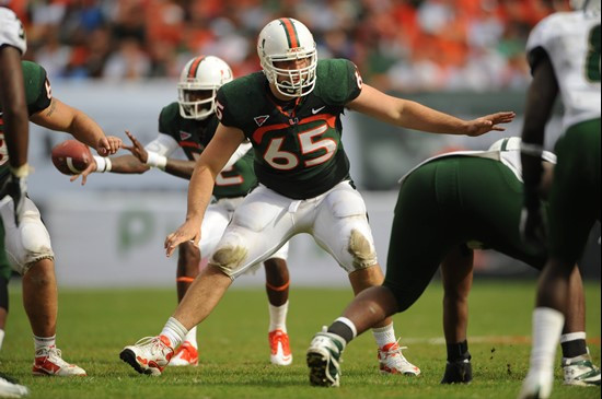 University of Miami Hurricanes offensive lineman Brandon Linder #65 gets set to block in a game against the University of South Florida Bulls at Sun...