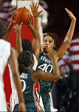 Miami's Shawnice Wilson (40) tries to block the shot of North Carolina State's Bonae Holston during the first hal. Wilson had 17 points and 17...