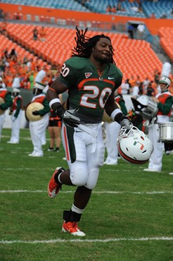 University of Miami Hurricanes running back Damien Berry #20 plays in a game against University of South Florida Bulls at Sun Life Stadium on November...