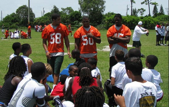 Jordan Futch, Darryl Sharpton and Ramon Buchanan speak to kids at the Ezell Hester Community Center