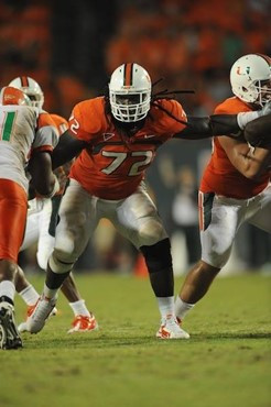 University of Miami Hurricanes offensive lineman Brandon Washington #72 gets set to block against the Florida A&amp;M Rattlers at Sun Life Stadium on...