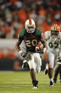 University of Miami Hurricanes running back Damien Berry #20 breaks tackles and makes a long run in a game against the Florida A&M Rattlers at Land...