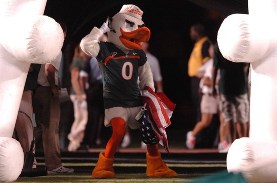 Sebastian the Ibis leads the University of Miami Hurricanes through a tunnel of smoke in a game against the North Carolina Tar Heels at Sun Life...