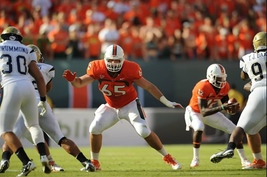 University of Miami Hurricanes offensive lineman Brandon Linder #65 gets set to block in a game against the Georgia Tech Yellow Jackets at Sun Life...