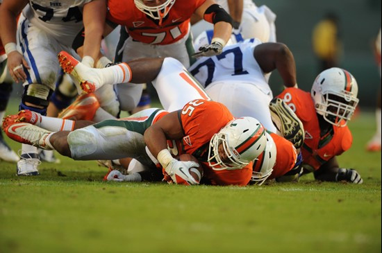 University of Miami Hurricanes defensive lineman Olivier Vemon #35 recovers a fumble in a game against the Duke Blue Devils at Sun Life Stadium on...