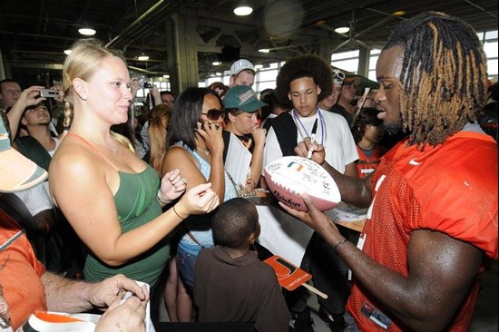 Graig Cooper signing autographs for fans at BankUnited CanesFest