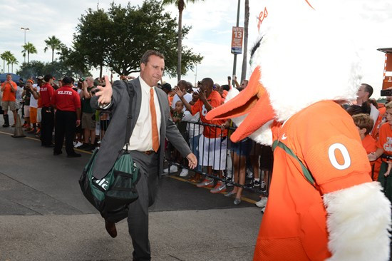 Assistant Head Coach and Defensive Coordinator Mark D'Onofrio is greated by fans as the team arrives at Sun Life Stadium.  The University of Miami...
