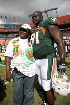 University of Miami Hurricanes Senior defensive tackle Joe Joseph #91 poses with his family before a game against the Duke Blue Devils at Land Shark...