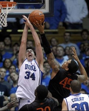 Duke's Ryan Kelly (34) blocks Miami's Julian Gamble (45). (AP Photo/Sara D. Davis)