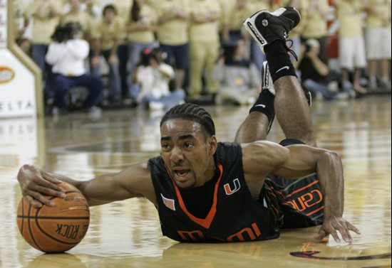 Miami guard Lance Hurdle rakes in a loose ball against Georgia Tech during the second half of a basketball game Sunday, Feb. 17, 2008, in Atlanta....