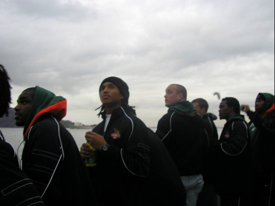 Players look on as the boat approaches the island.