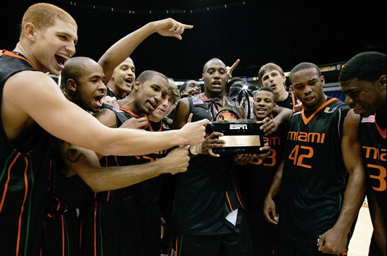 Miami's Anthony King, center, holds the trophy during the team celebration after winning the Puerto Rico Tip-Off college basketball tournament in San...