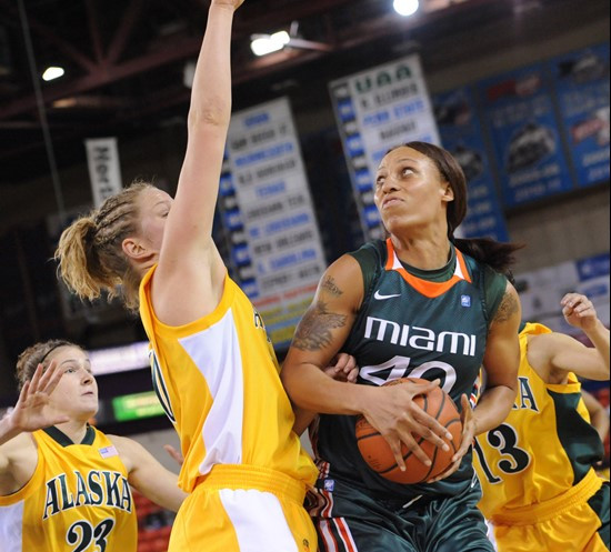 Alaska Anchorage's Hannah Johansen, at left, defends Miami's Shawnice Williams. (AP Photo/Michael Dinneen)