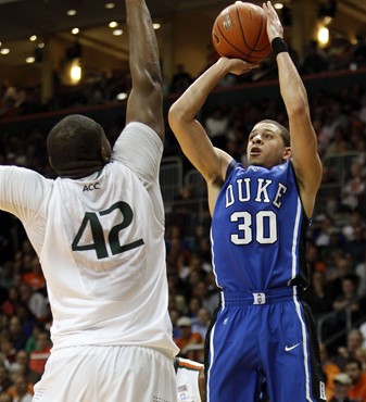 Duke's Seth Curry prepares to shoot over Miami's Reggie Johnson. (AP Photo/Alan Diaz)