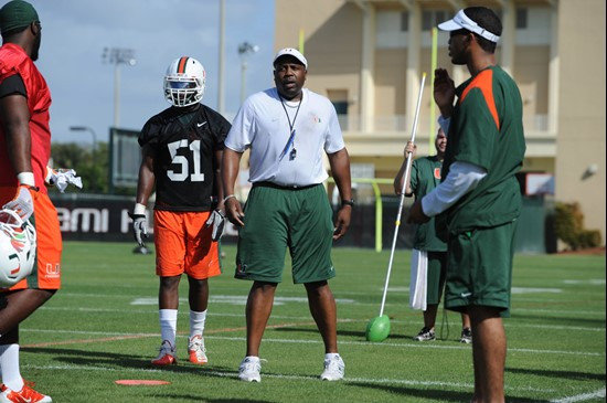 University of Miami Defenisve Line Coach, Jethro Franklin, instructs his team on how he wants them to execute his game plan during a spring practice...