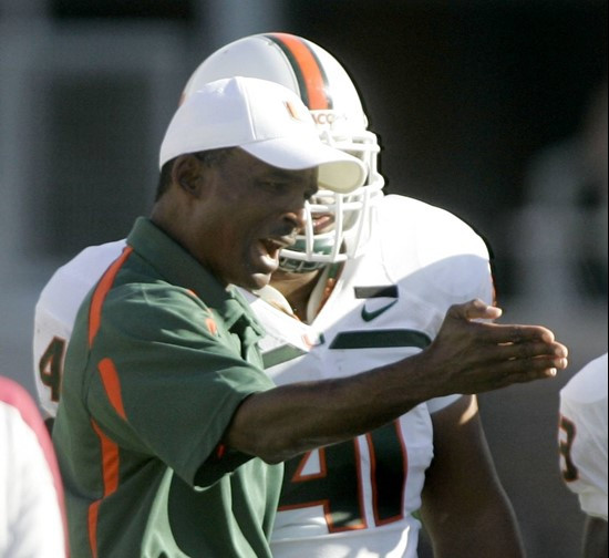 Miami head coach Randy Shannon talks to player Jerrell Mabry during the second quarter. (AP Photo/Phil Coale)