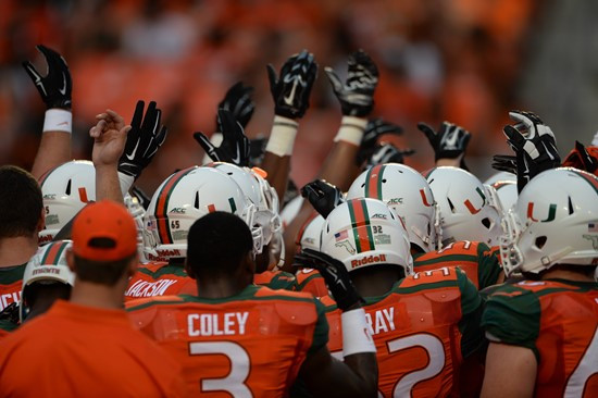 University of Miami Hurricane players meet at the 50 yard line in a sign of unity before a game against the Florida A&M Rattlers at Sun Life Stadium...