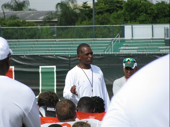 Randy Shannon speaks to the team after practice Tuesday morning at the Greentree Practice Fields.