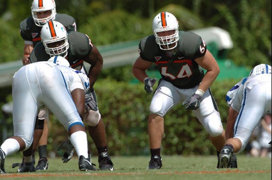 University of Miami offensive lineman Jason Fox #64 gets set to block in a game against the Duke University Blue Devils at the Orange Bowl on...