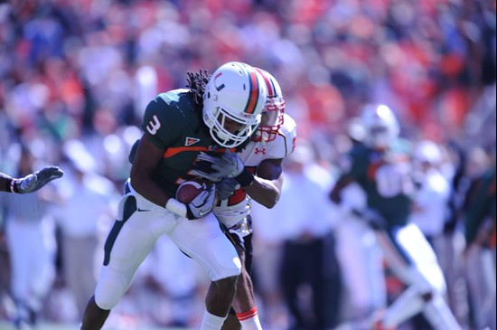 University of Miami Hurricanes wide receiver Travis Benjamin #3 catches a pass in a game against the Maryland Terrapins at Sun Life Stadium on...