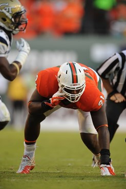 University of Miami Hurricanes defensive lineman Olsen Pierre #91 plays in a game against the Georgia Tech Yellow Jackets at Sun Life Stadium on...