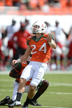 University of Miami Hurricanes Kicker/Punter Michael Badgley #24 plays in a game against the Cincinnati Bearcats at Sun Life Stadium on October 11,...