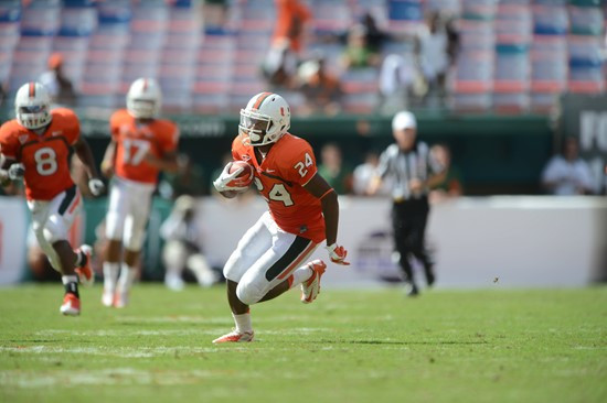 University of Miami Hurricanes defensive back Davon Johnson #24 carries the ball in a game against the North Carolina State Wolfpack at Sun Life...