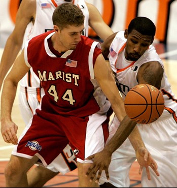 Marist's Ryan Schneider and  James Dews battle for a loose ball during the first half. (AP Photo/Andres Leighton)