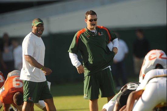 University of Miami Head Tight Ends Coach Brennan Carroll, and Linebackers Coach Michael Barrow, during a spring practice at Greentree Practice Fields...