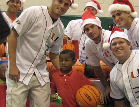 Members of the baseball team at the &acirc;?oeToy Fest&acirc;?? holiday celebration at the South Miami Rec Center in December.