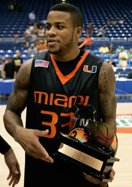 Miami's Jack McClinton shows his Most Valuable Player trophy during celebrations after winning the Puerto Rico Tip-Off college basketball tournament...