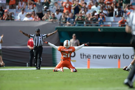 University of Miami Hurricanes defensive back Antonio Crawford #21 deflects a ball away in a game against the Wake Forest Demon Deacons at Sun Life...